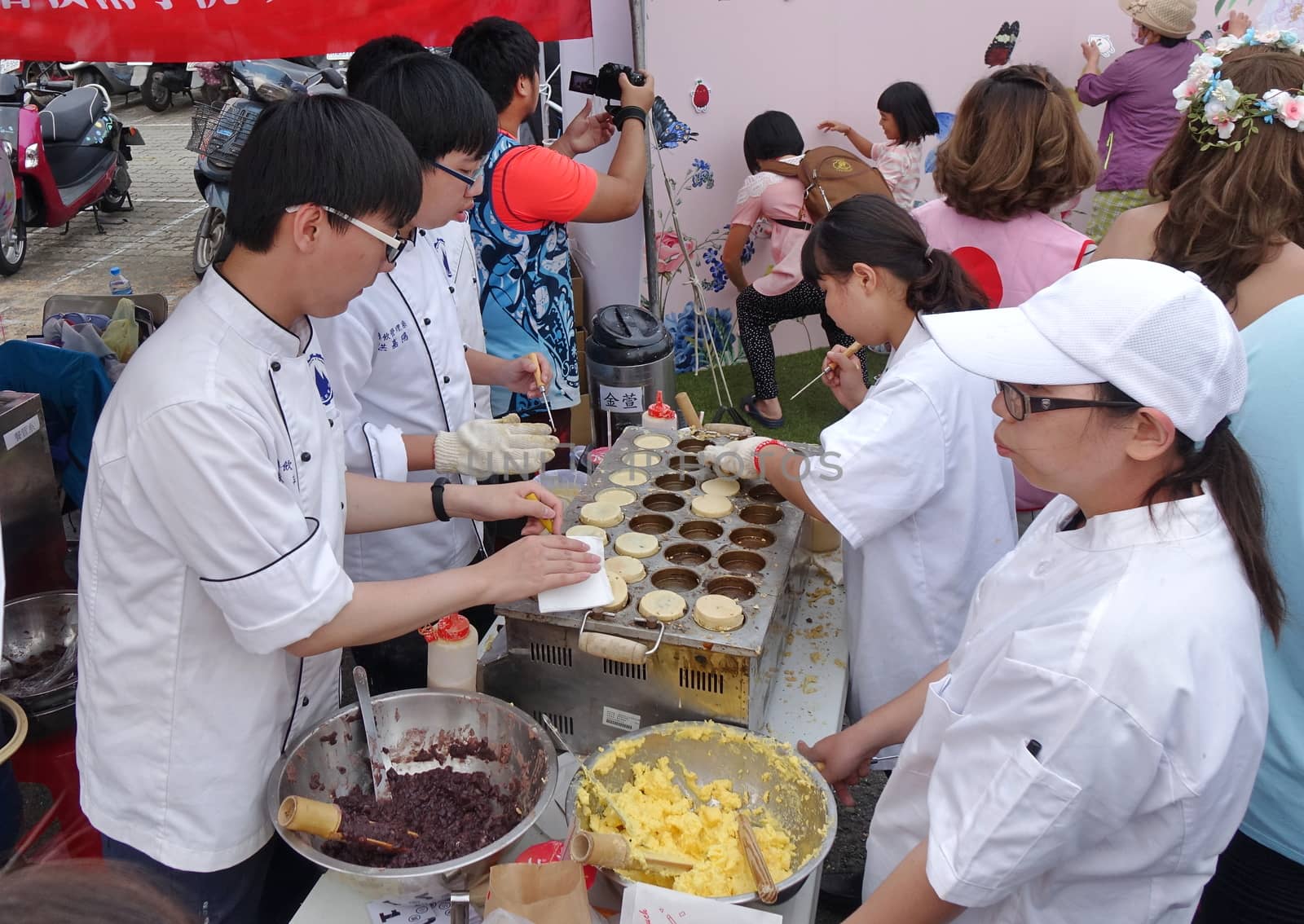 KAOHSIUNG, TAIWAN -- DECEMBER 8, 2018: Cooking school students make red bean cakes, or Imagawayaki, as the Japanese call it, a popular sweet food in Taiwan.