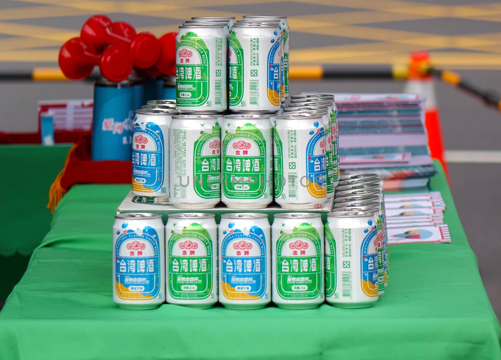 KAOHSIUNG, TAIWAN -- AUGUST 3, 2019: A street vendor sells cans of Taiwan Beer at an outdoor event.
