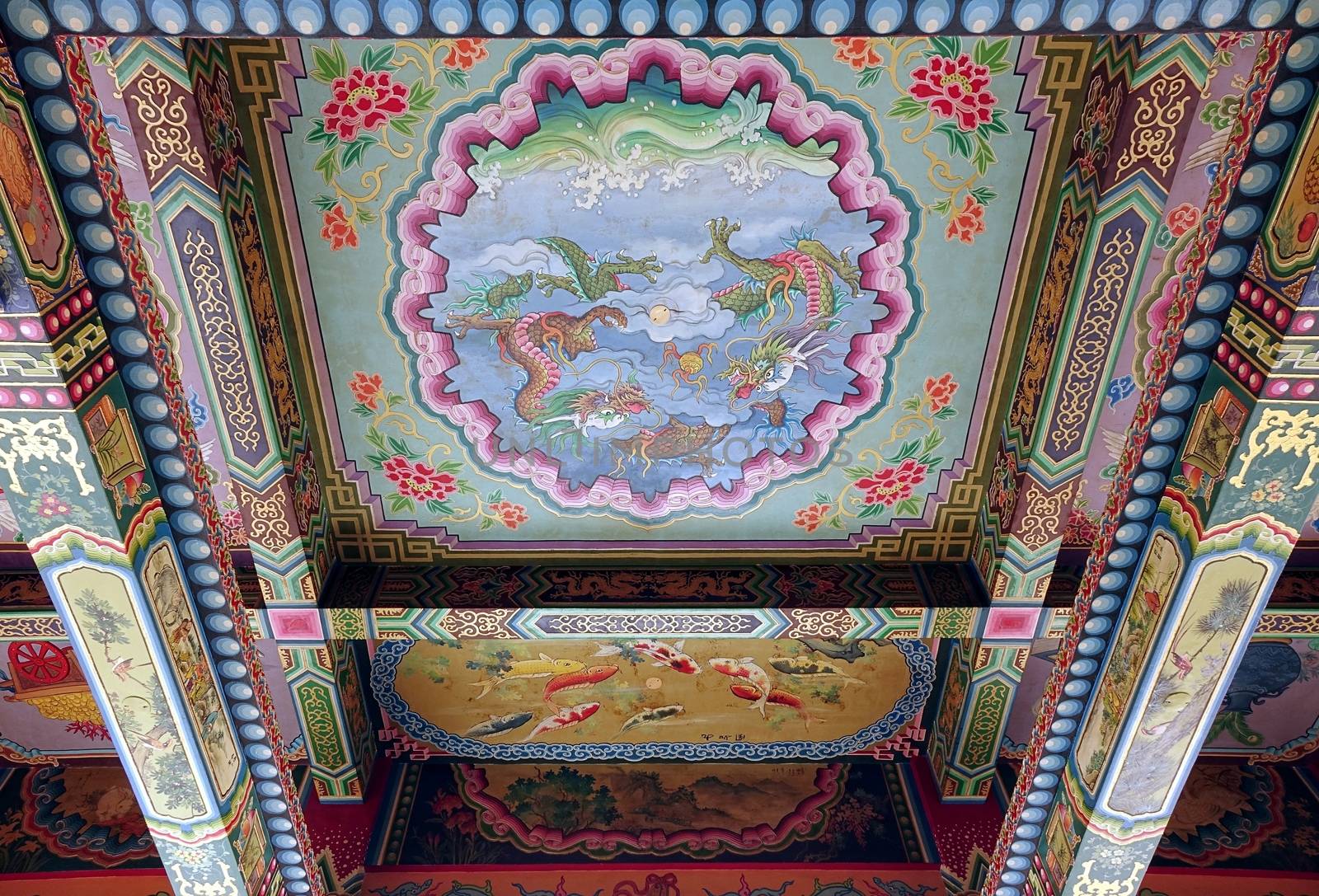KAOHSIUNG, TAIWAN -- JUNE 24, 2014: The ceiling of the Wumiao Temple in Kaohsiung shows colorful paintings of religious and mythological themes.