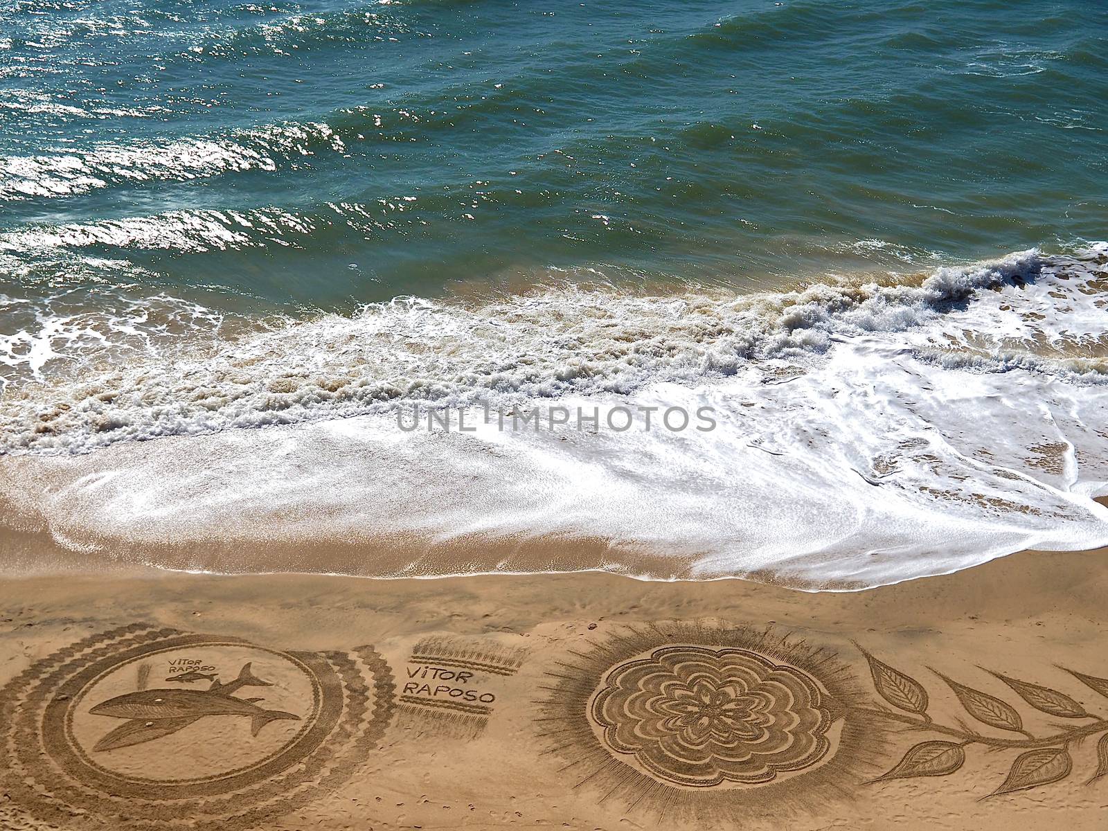 Beautiful beach mandala with a flower and dolphins in Albufeira in Portugal by Stimmungsbilder