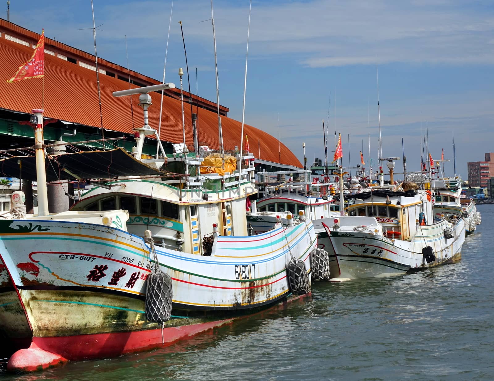 KAOHSIUNG, TAIWAN -- JUNE 27, 2019: Traditional Chinese fishing boats are anchored at the Gushan Ferry Pier.