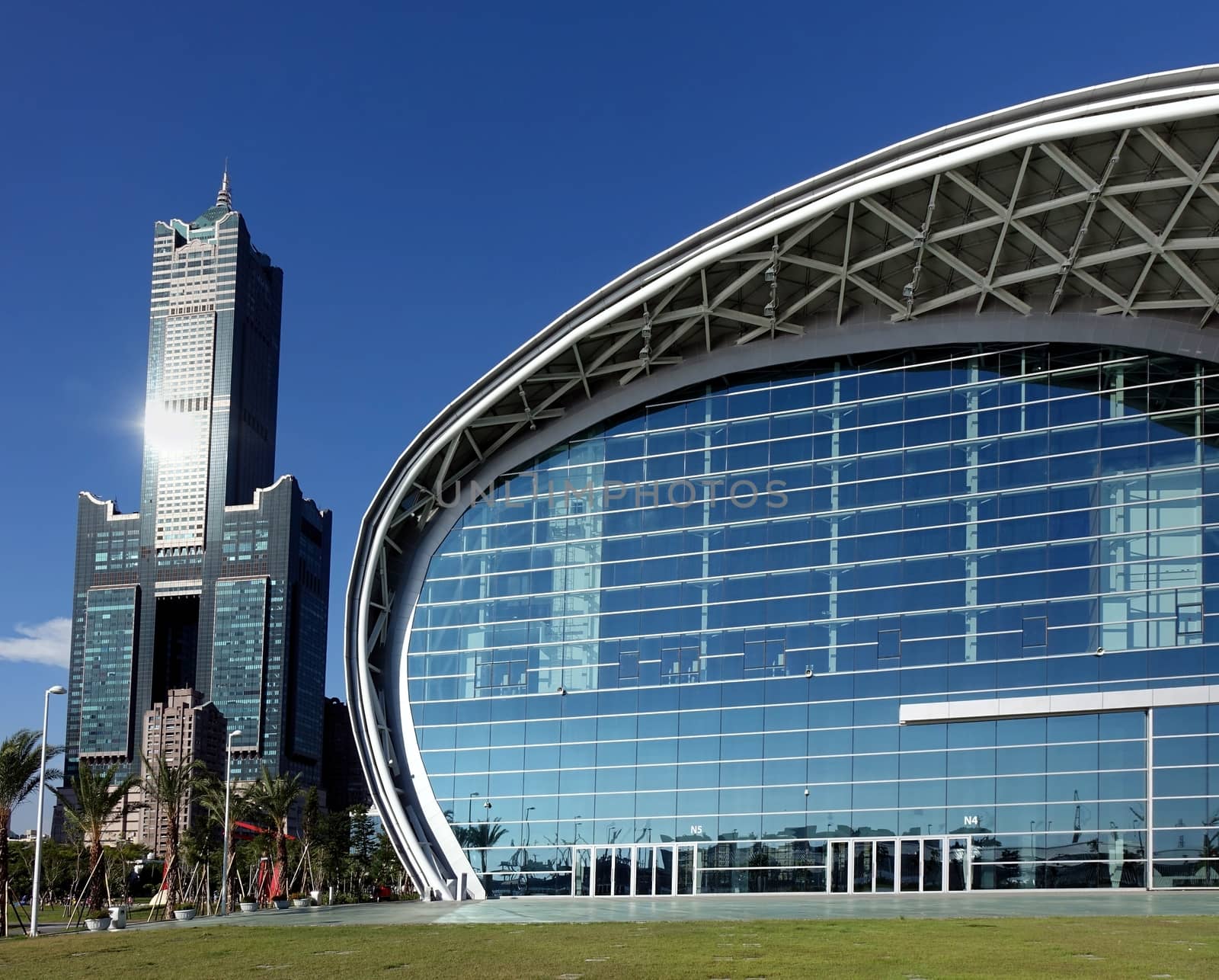 KAOHSIUNG, TAIWAN -- JULY 13, 2014:  View of the new Kaohsiung Exhibition Center and the 85 story Tuntex Tower