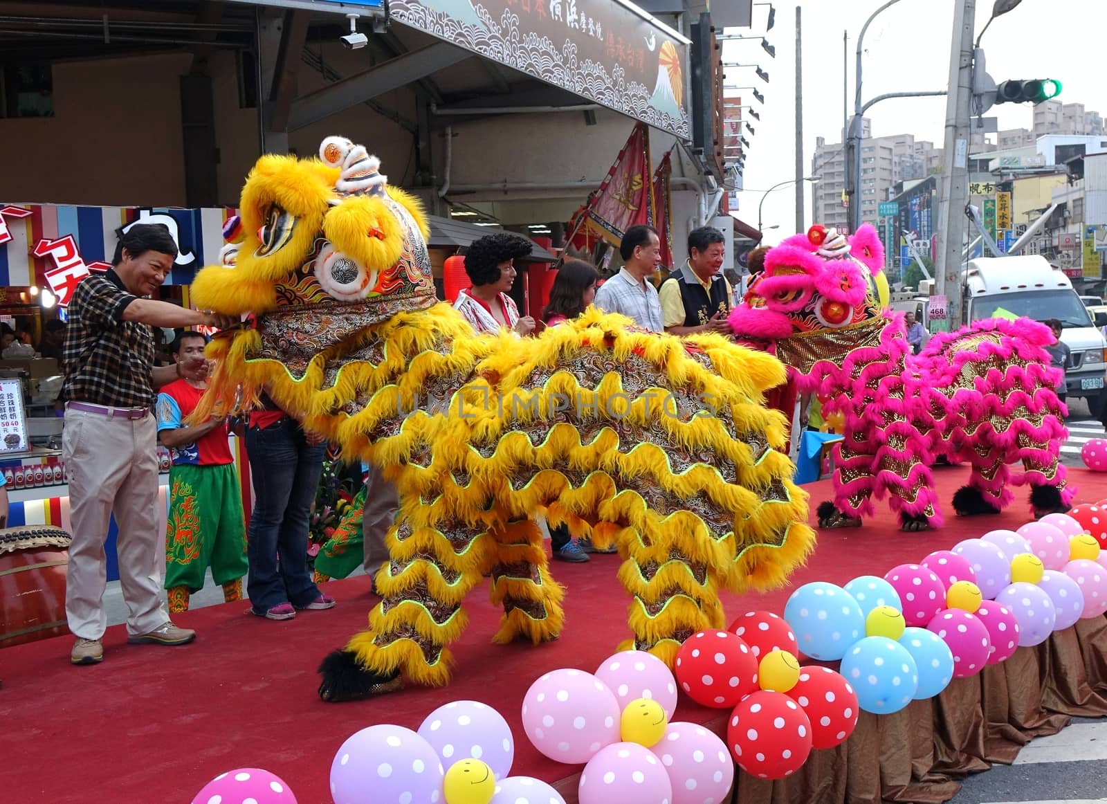 KAOHSIUNG, TAIWAN -- NOVEMBER 20, 2015: Traditional Chinese lion dancers perform at the opening ceremony of the Jiangguo Outdoor Market.