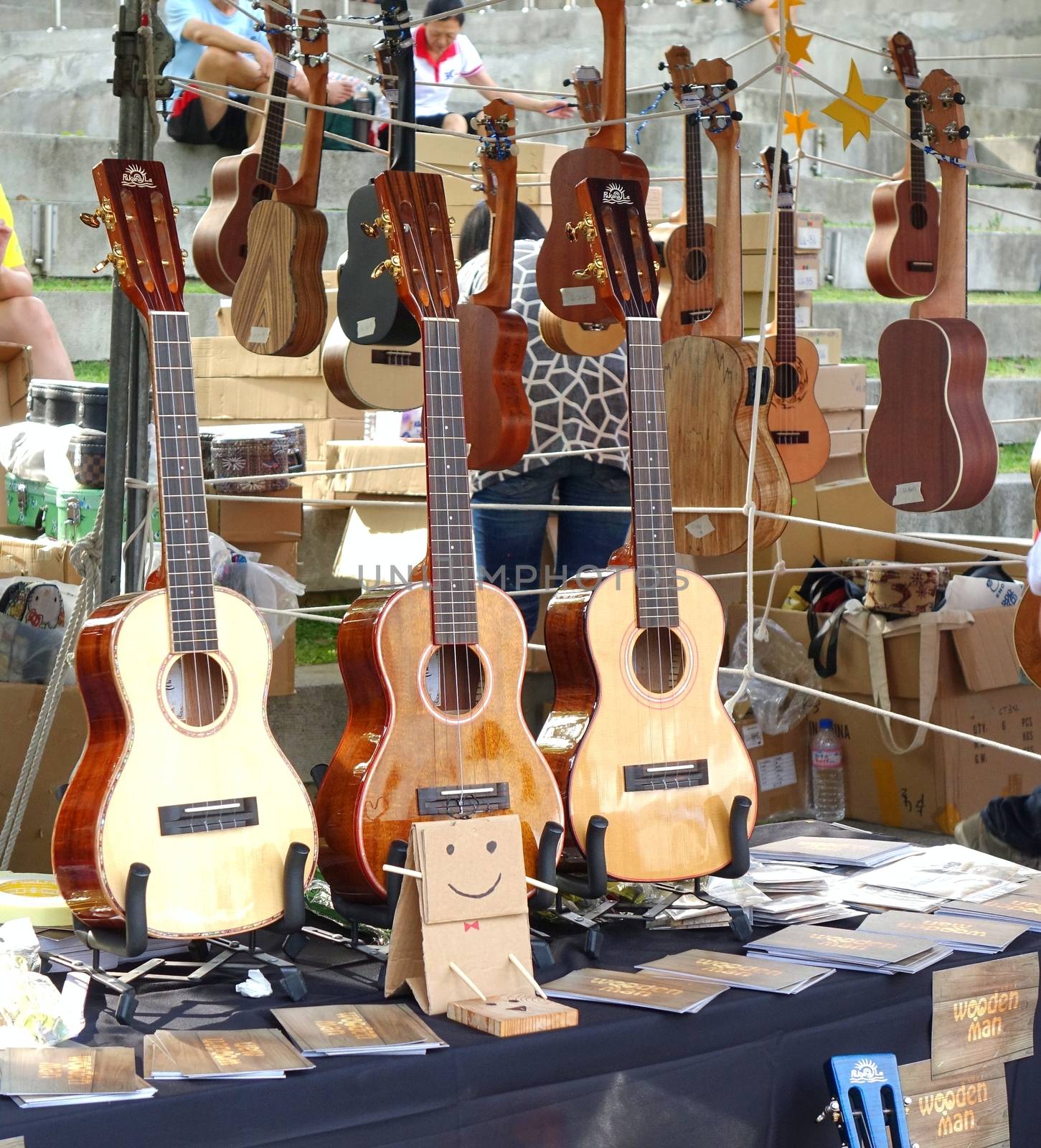 KAOHSIUNG, TAIWAN -- APRIL 23, 2016: Outdoor vendors sell musical string instruments at the 1st Pacific Rim Ukulele Festival, a free public outdoor event.