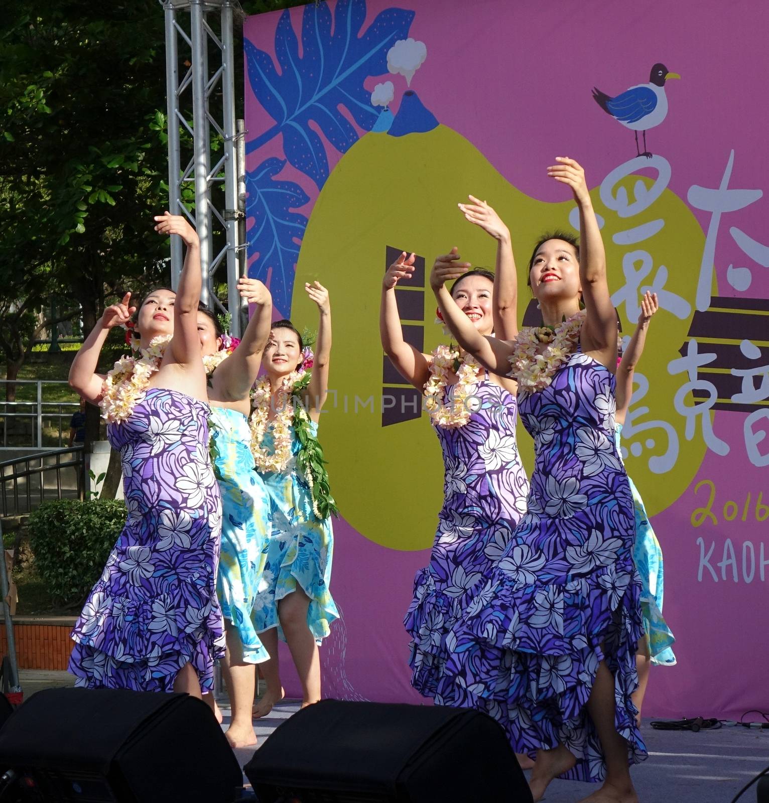 KAOHSIUNG, TAIWAN -- APRIL 23, 2016: A group of unidentified dancers performs a Hawaiian dance at the 1st Pacific Rim Ukulele Festival, a free outdoor event.