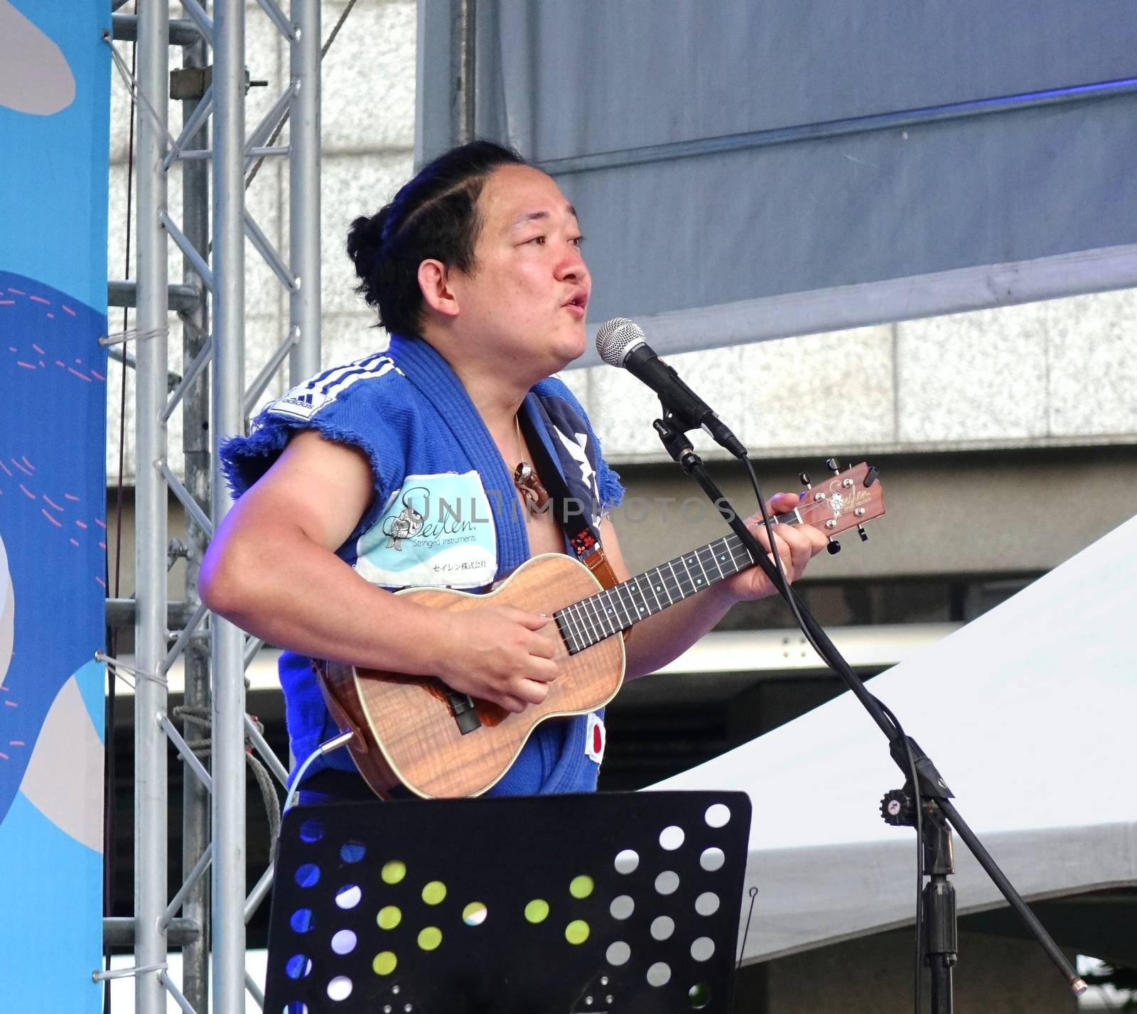 KAOHSIUNG, TAIWAN -- APRIL 23, 2016: Award-winning Japanese musician Yuta Uchiumi performs at the 1st Pacific Rim Ukulele Festival, a free outdoor event.