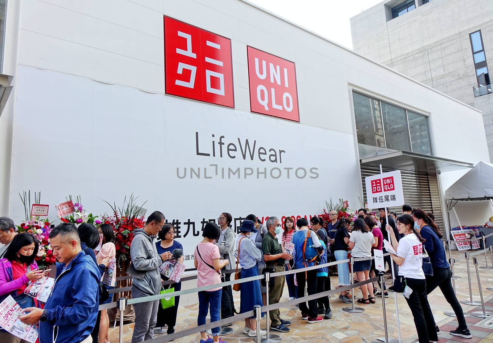 KAOHSIUNG, TAIWAN -- APRIL 20, 2018: People stand in line waiting for the grand opening of a new clothing store of the Uniqlo brand.
