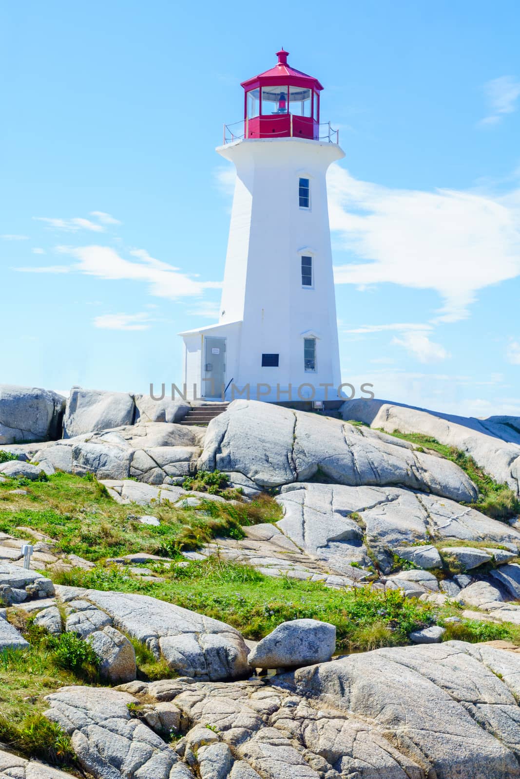View of the lighthouse of the fishing village Peggys Cove, in Nova Scotia, Canada