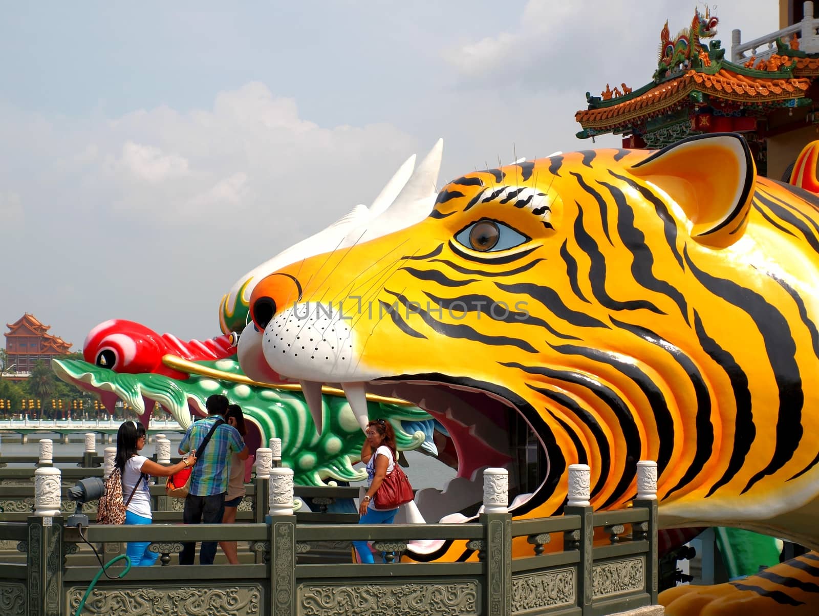 KAOHSIUNG, TAIWAN -- OCTOBER 13: Visitors emerge from the famous Tiger Pagoda at the yearly Wannian Folklore Festival on October 13, 2013 in Kaohsiung.
