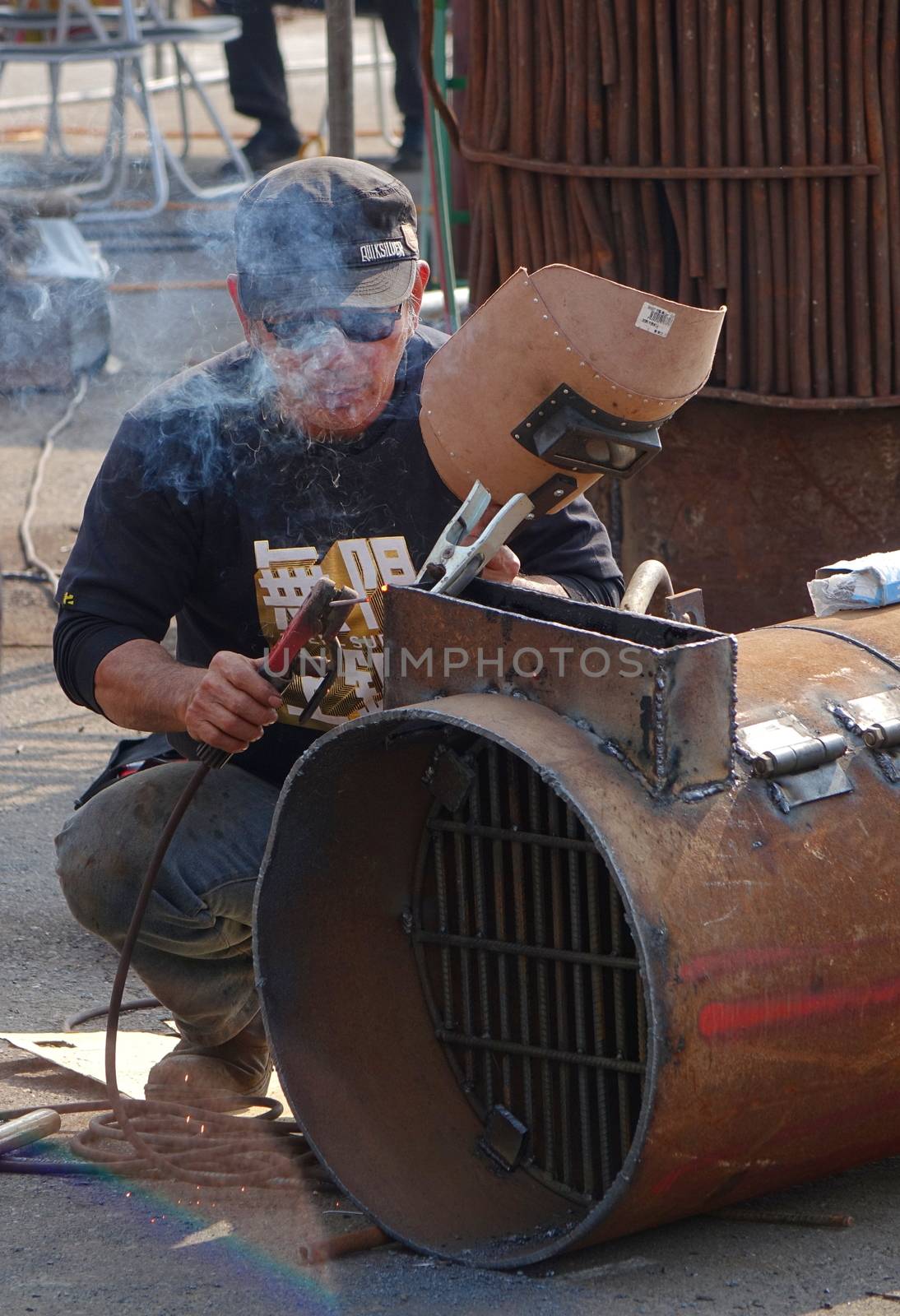 Welder Prepares to Join Two Metals Together by shiyali