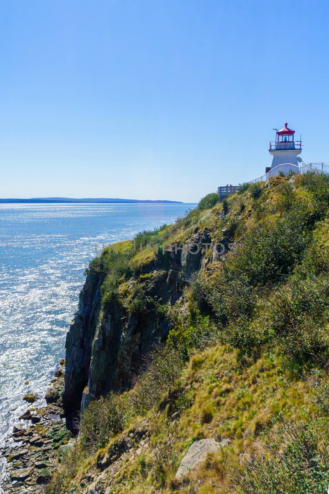 View of the Cape Enrage lighthouse, shoreline and cliffs, in New Brunswick, Canada