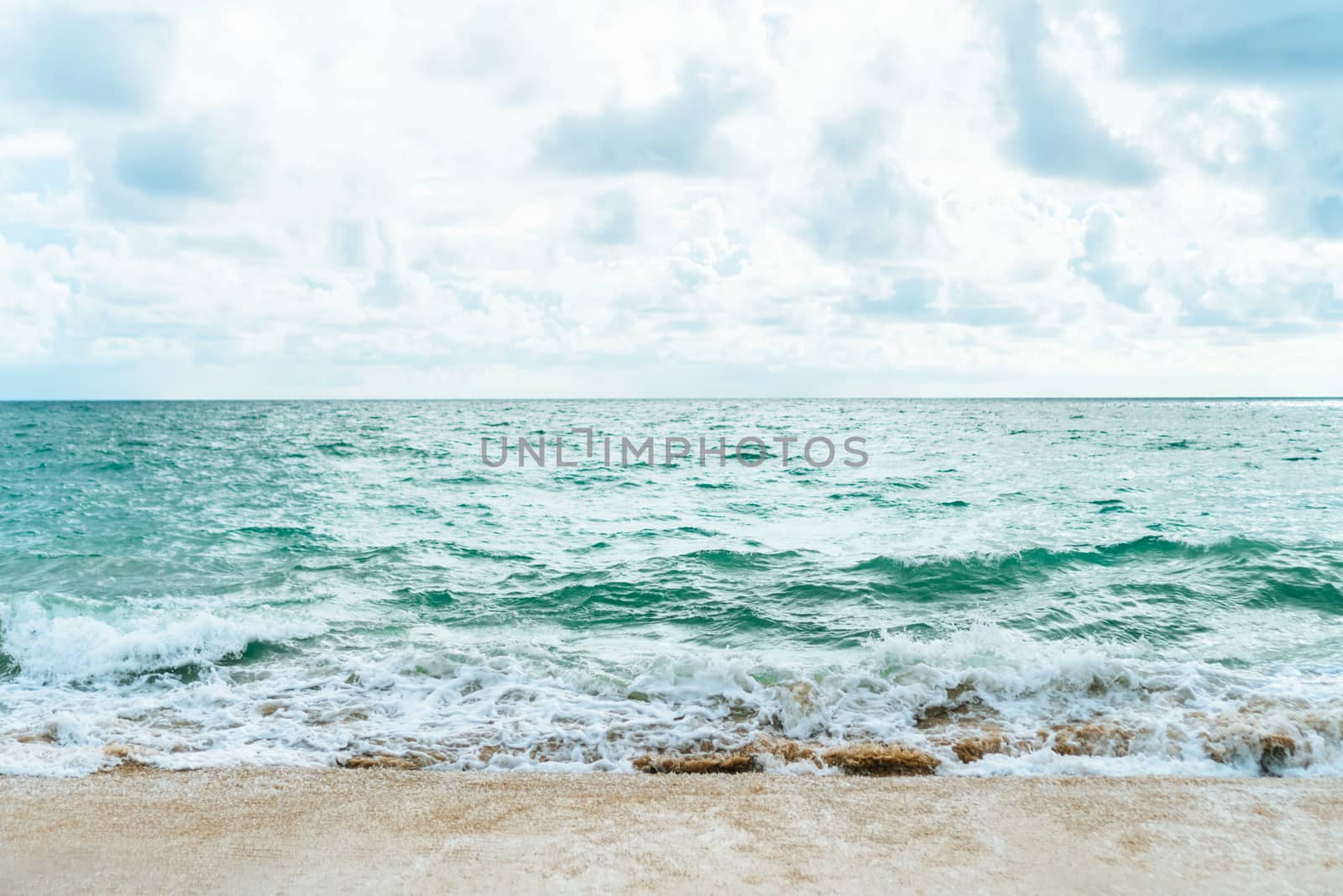 Tropical nature clean beach and white sand in summer with sun light blue sky and bokeh abstract  background.