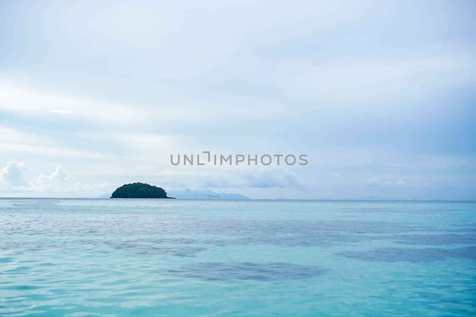 Tropical nature clean beach and white sand in summer with sun light blue sky and bokeh abstract  background.