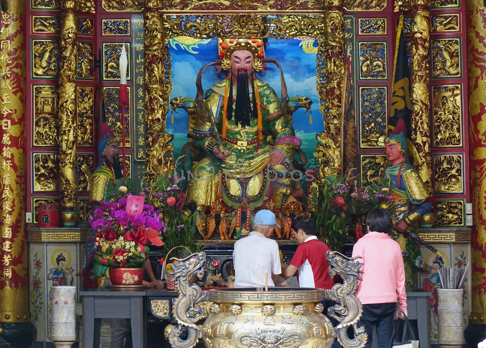 KAOHSIUNG, TAIWAN -- OCTOBER 19, 2018: People bring offerings and pray at the altar of the Yimin Temple.
