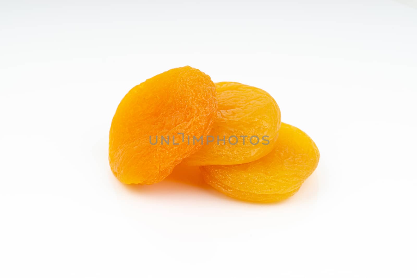 Dried apricot isolated on a white background by silverwings