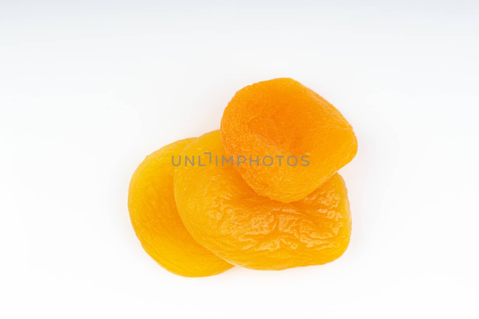 Dried apricot isolated on a white background by silverwings