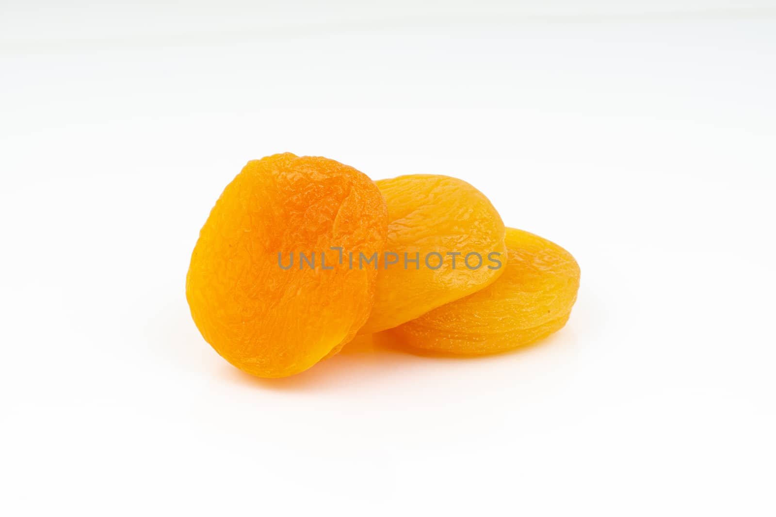 Dried apricot isolated on a white background by silverwings