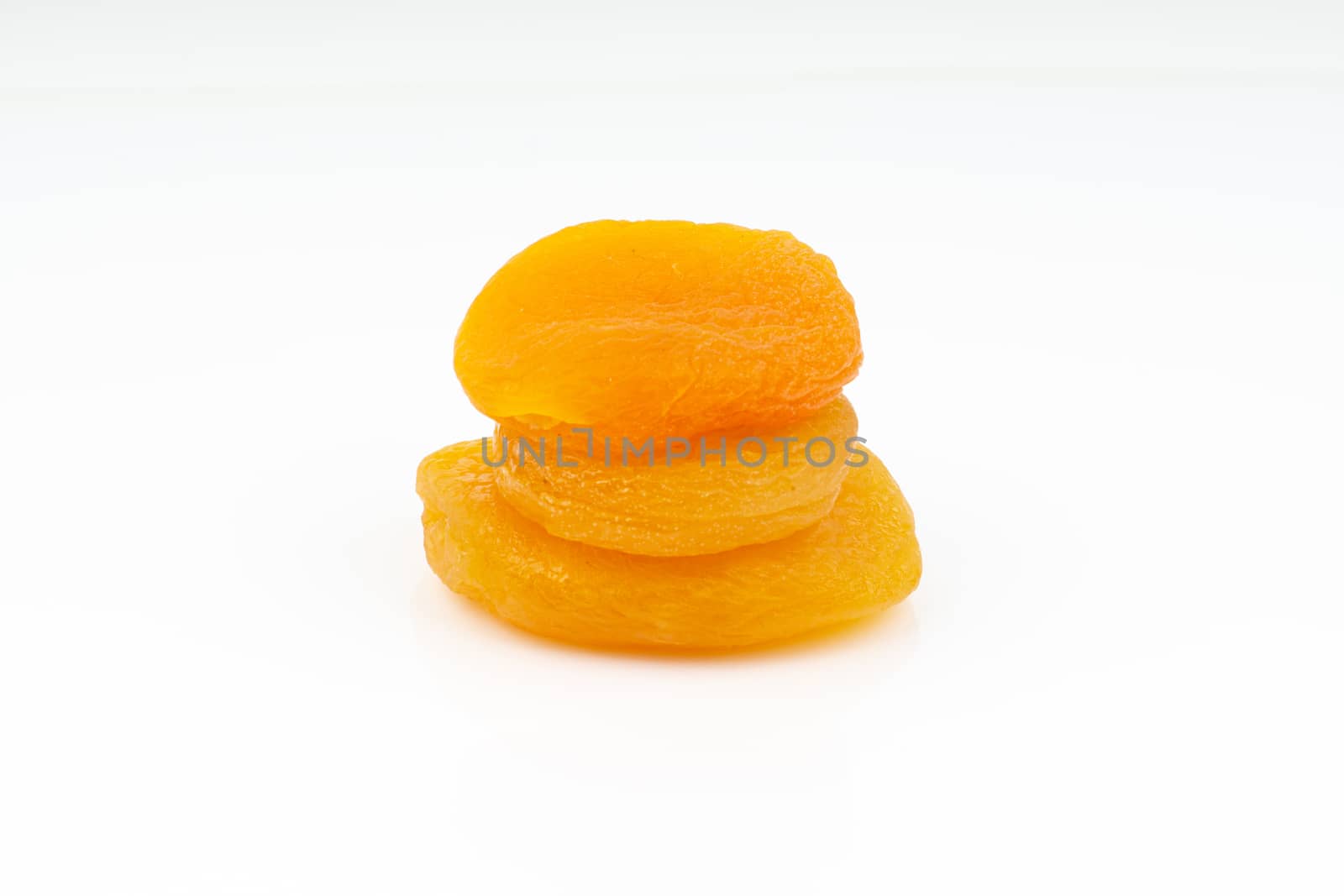 Dried apricot isolated on a white background by silverwings