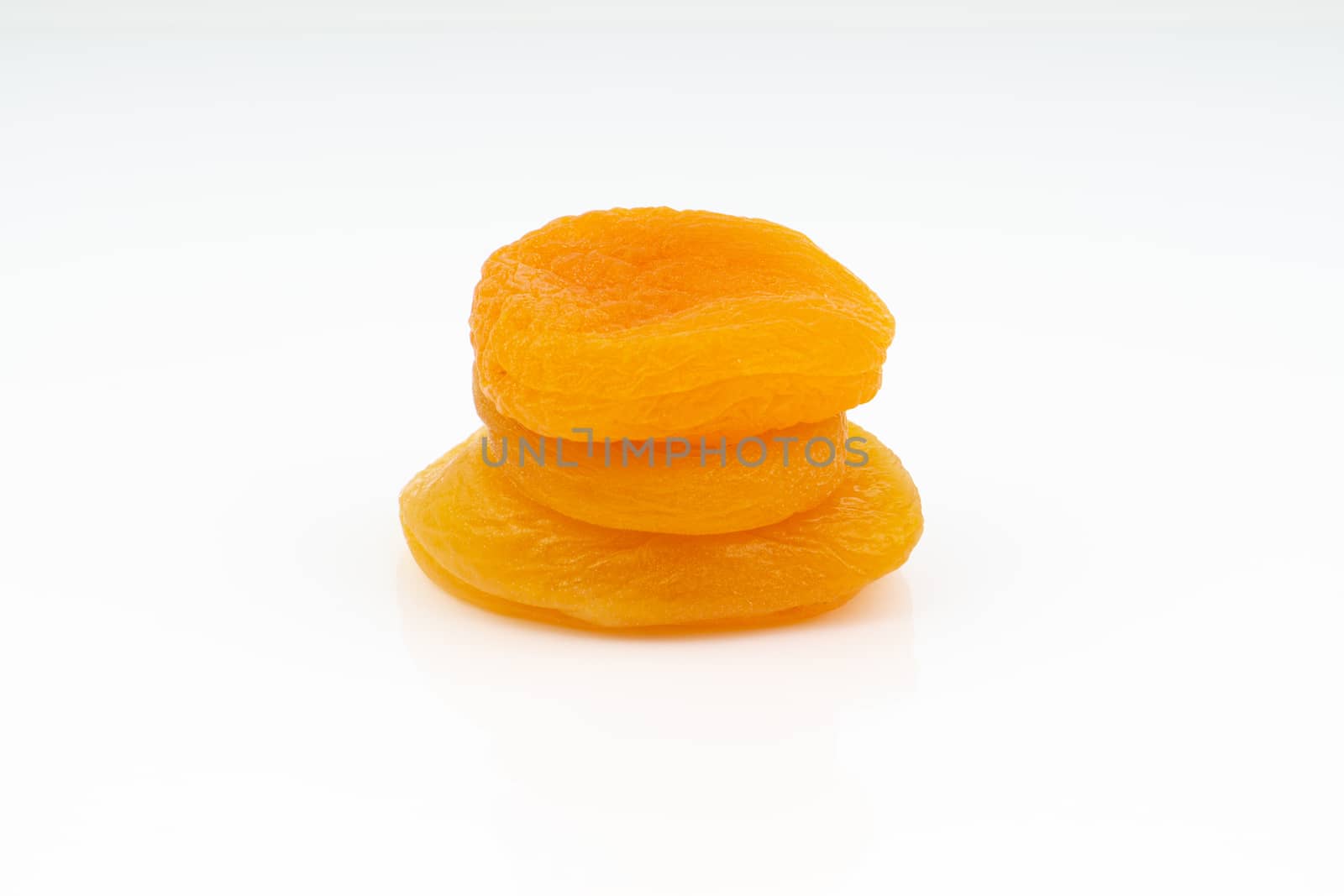 Dried apricot isolated on a white background by silverwings