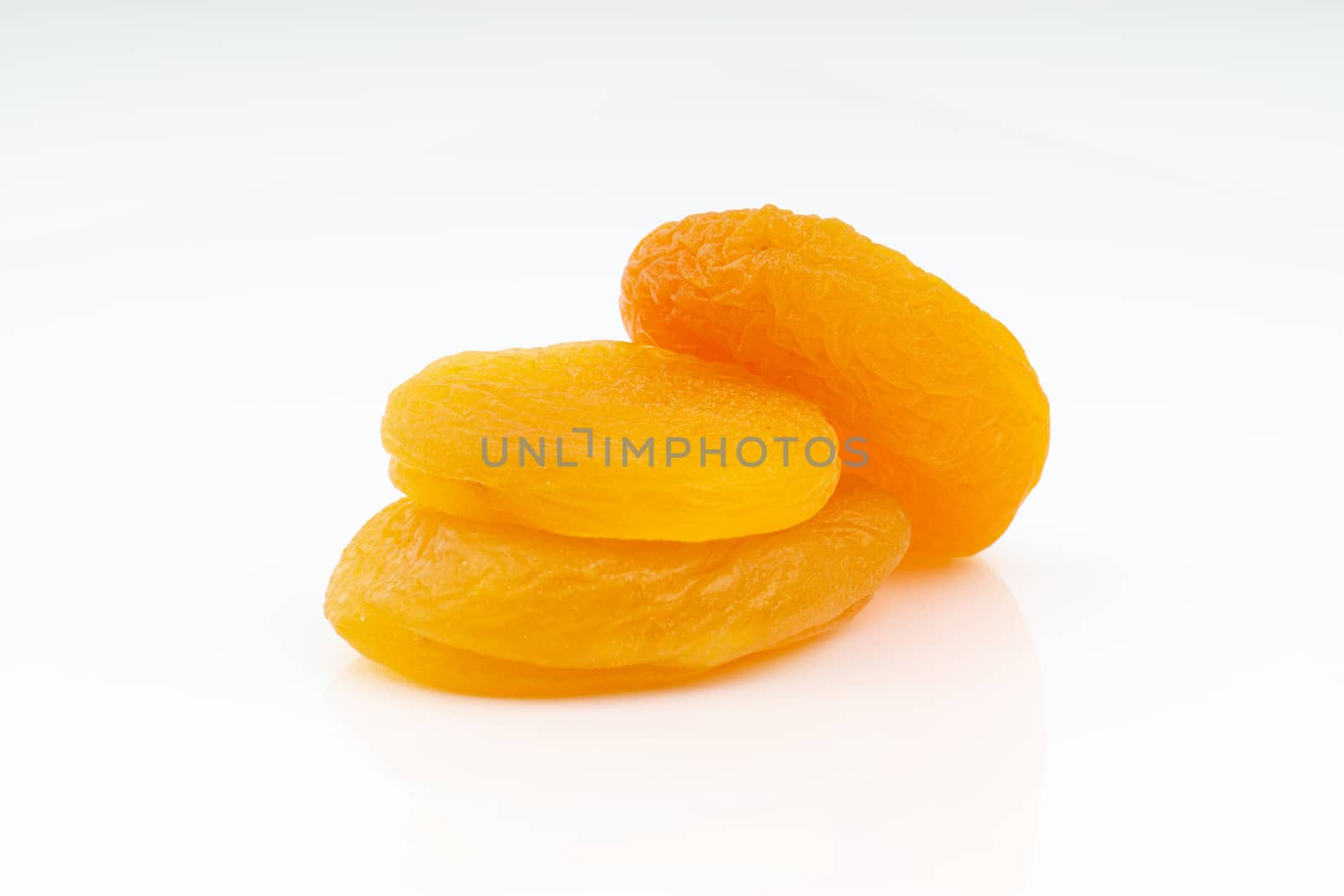 Dried apricot isolated on a white background by silverwings