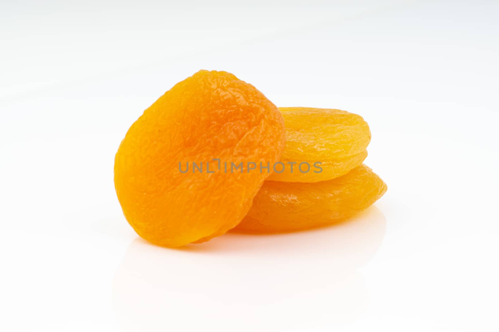 Dried apricot isolated on a white background by silverwings