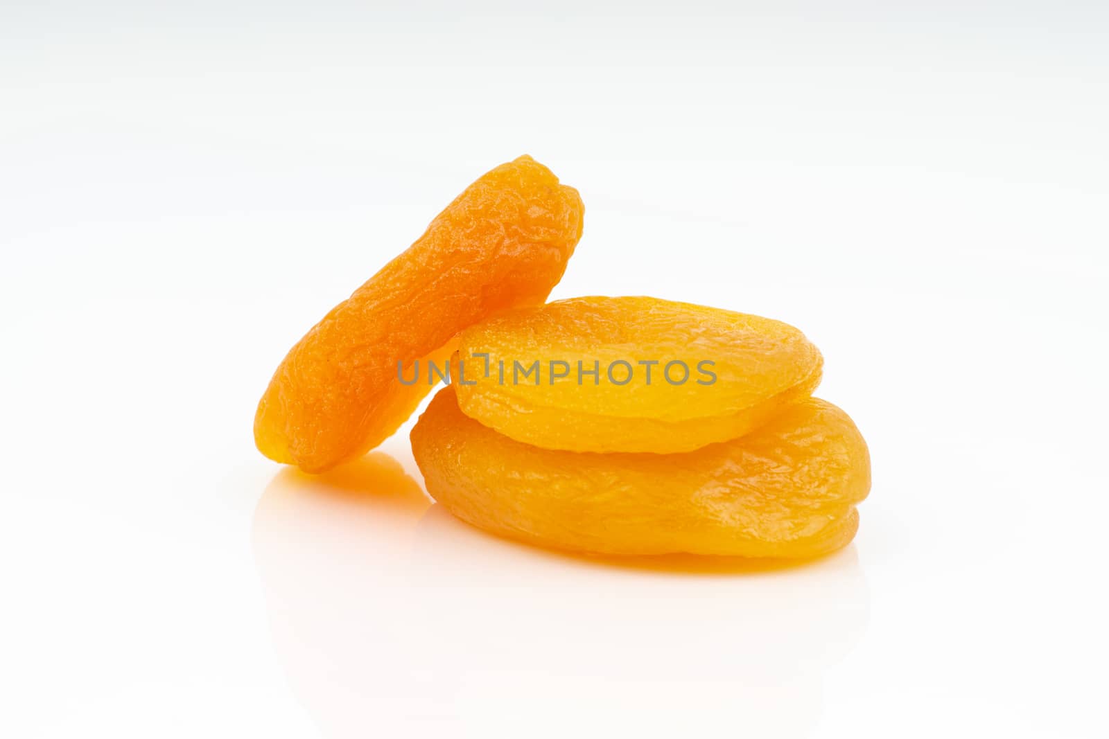 Dried apricot isolated on a white background by silverwings