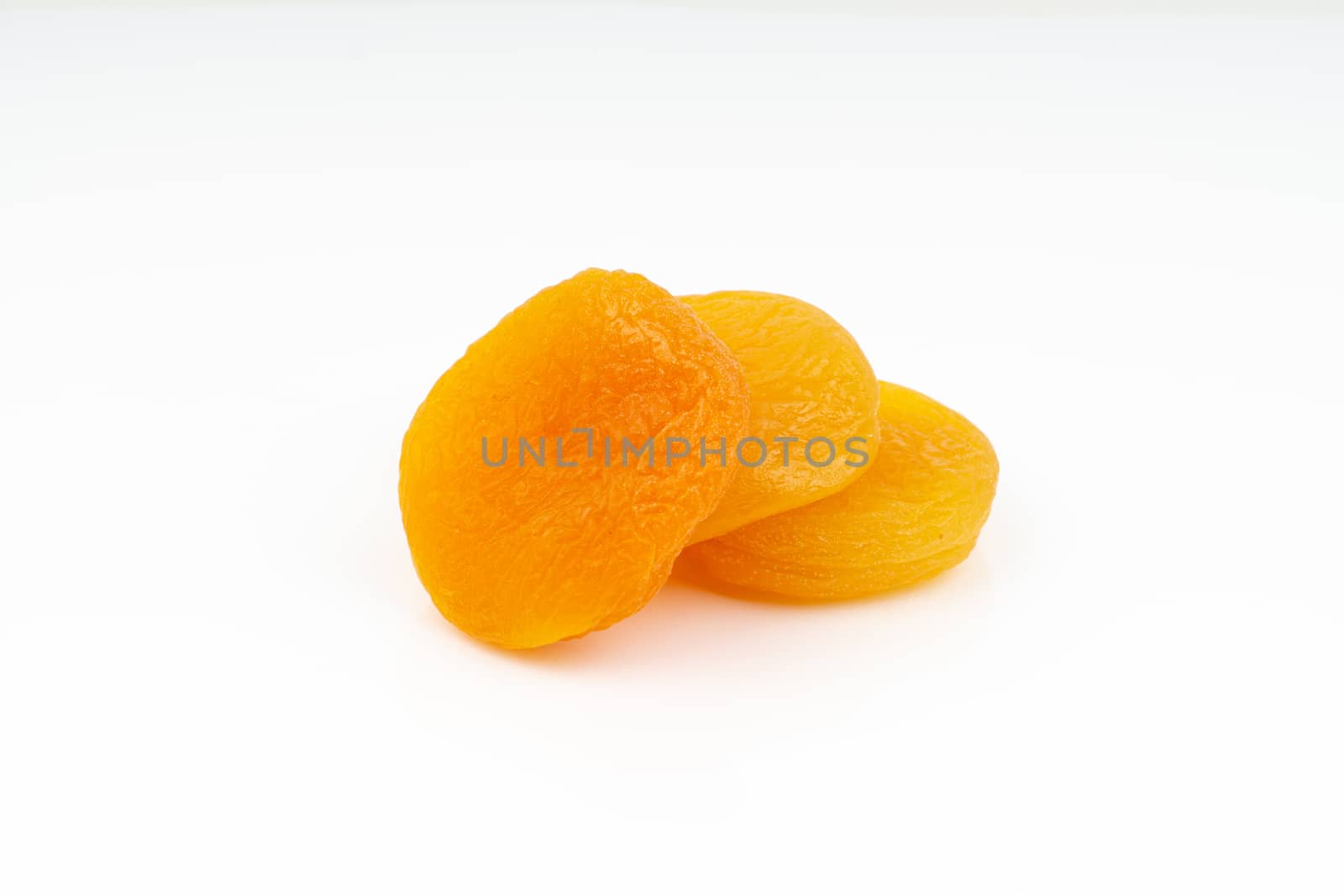 Dried apricot isolated on a white background by silverwings