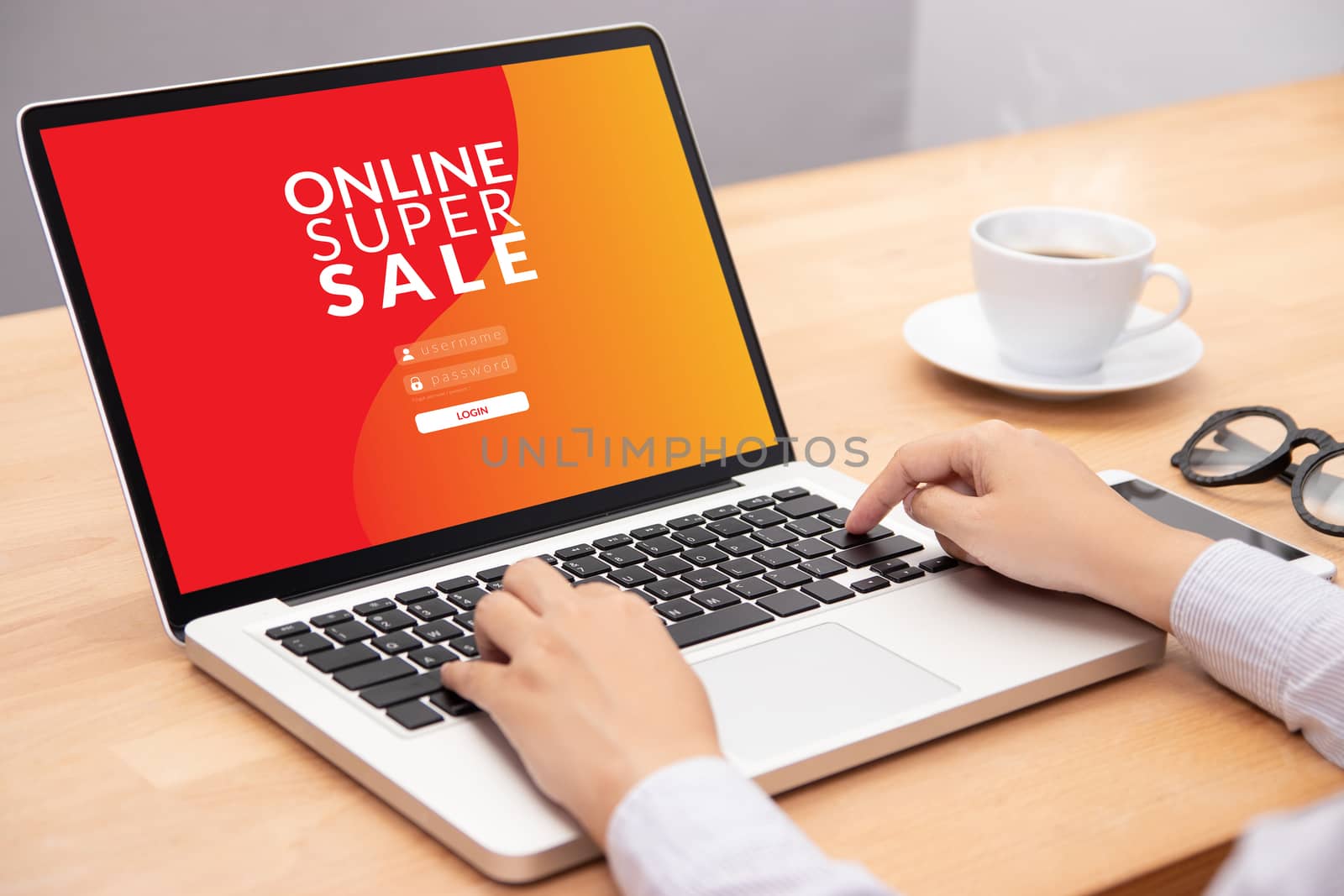 woman login with password on laptop computer for shopping online website with promotion sale discount campaign on screen by asiandelight