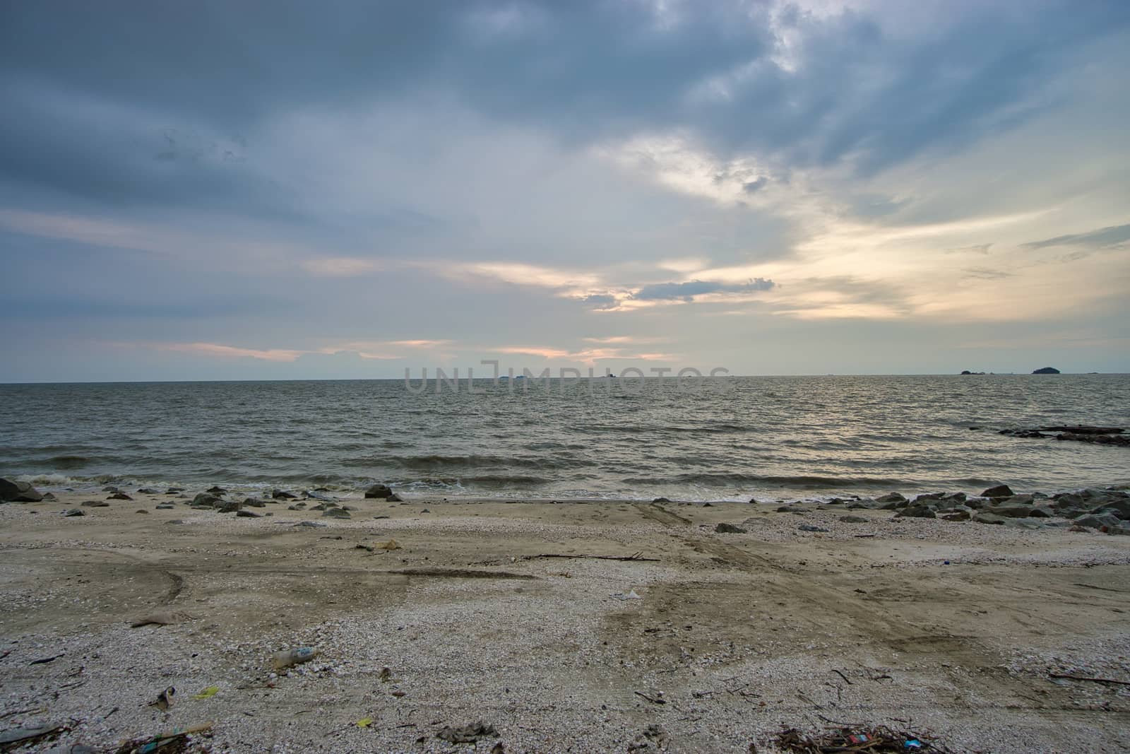 Peaceful beach view and waves during sunset at Jeram, Kuala Selangor Malaysia