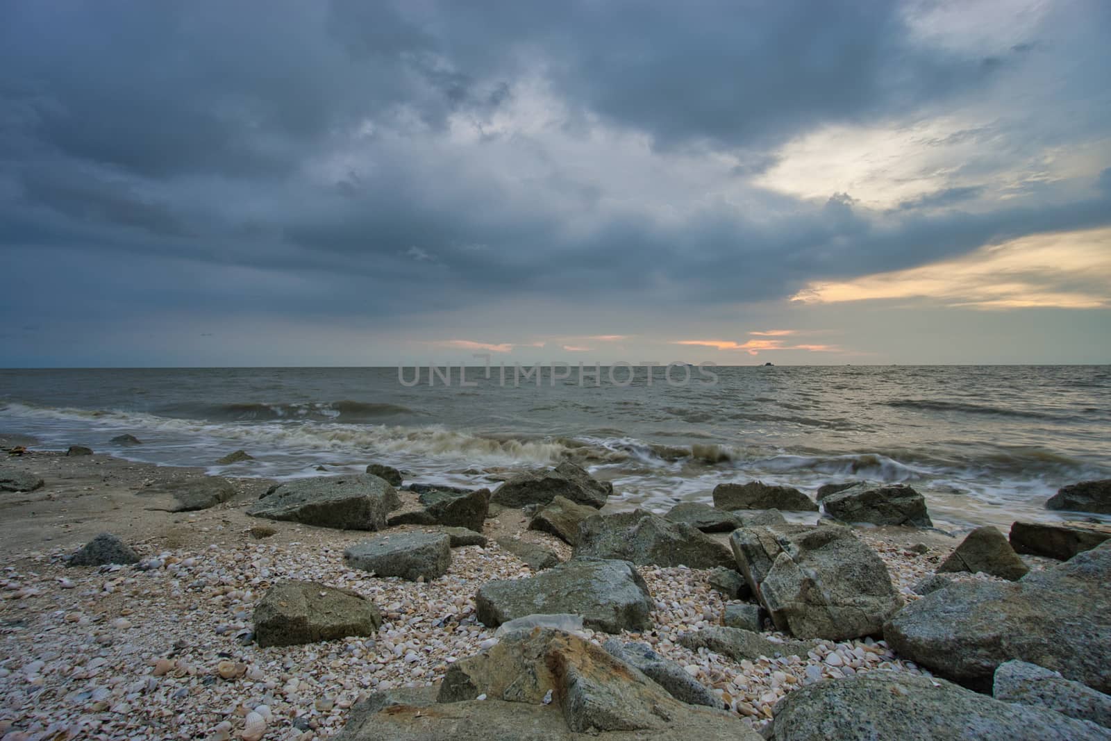 Peaceful beach view and waves during sunset at Jeram, Kuala Selangor Malaysia