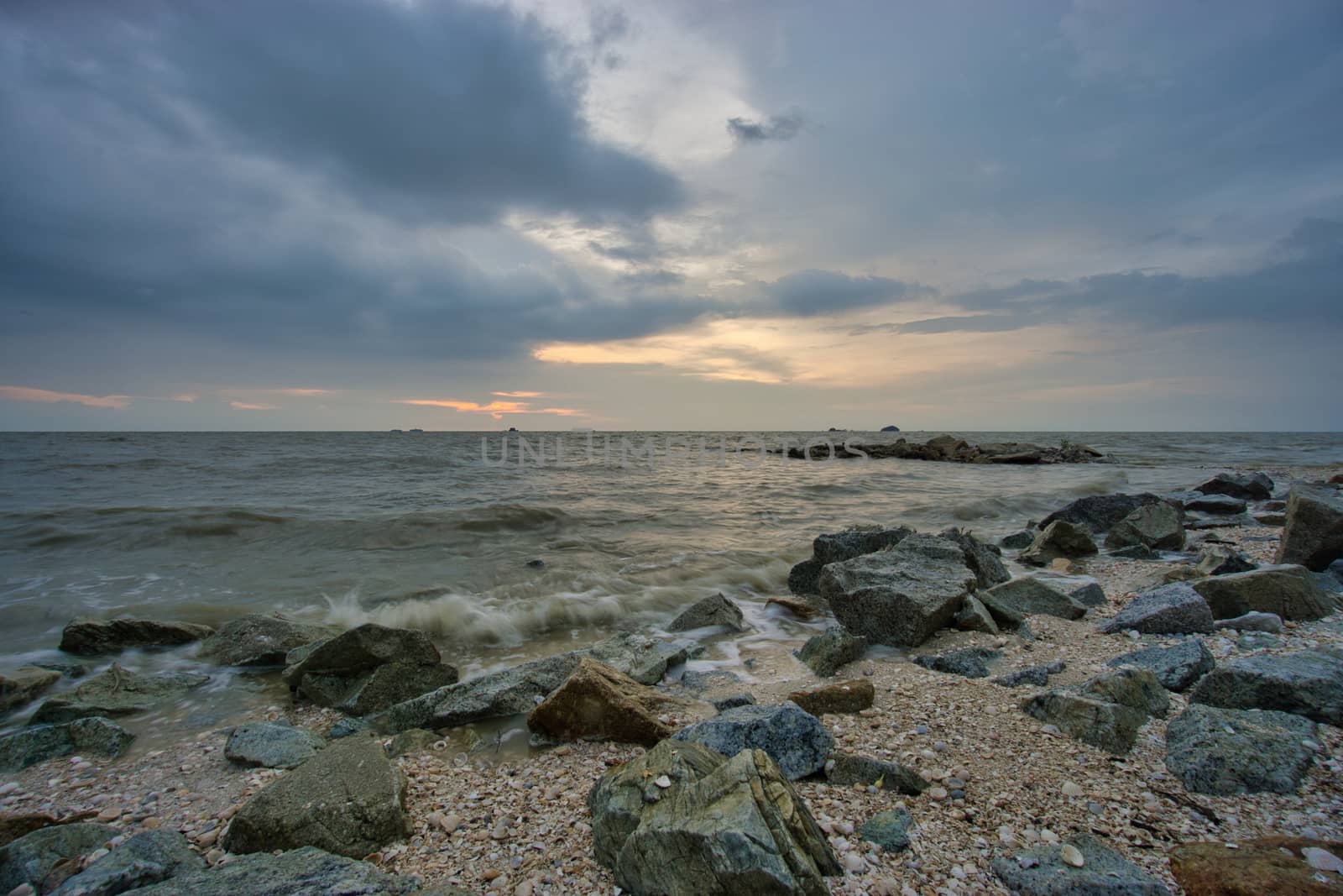 Peaceful beach view and waves during sunset at Jeram, Kuala Selangor Malaysia