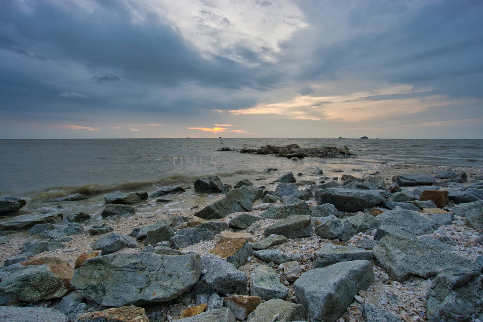 Peaceful beach view and waves during sunset at Jeram, Kuala Selangor Malaysia