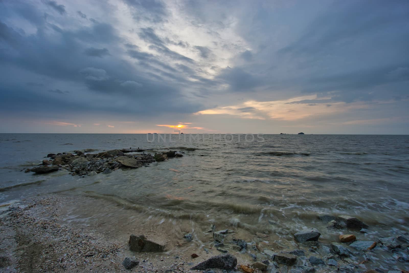 Peaceful beach view and waves during sunset at Jeram, Kuala Selangor Malaysia