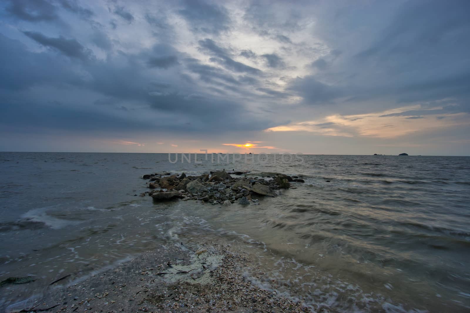 Peaceful beach view and waves during sunset at Jeram, Kuala Selangor Malaysia