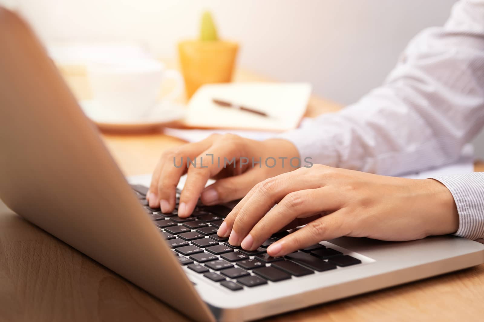 businesswoman working with notebook laptop computer, using finger with keyboard for typing or keying by asiandelight