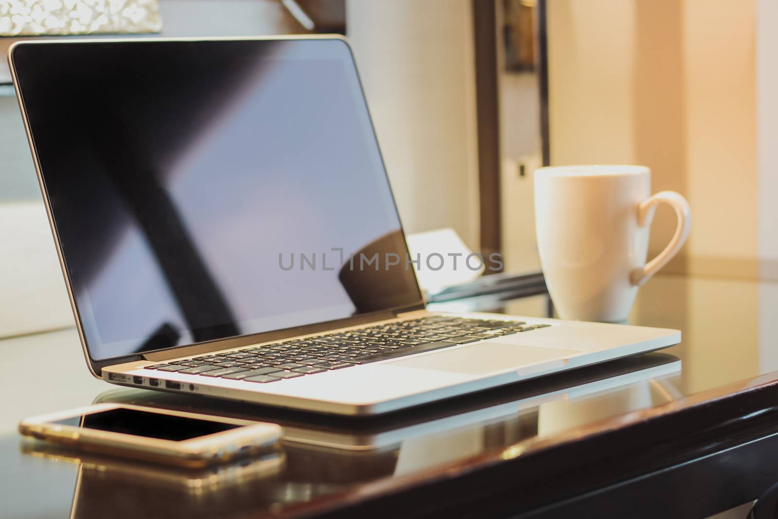 Workspace desk with computer laptop and a cup of coffee with smartphone, working at home concept