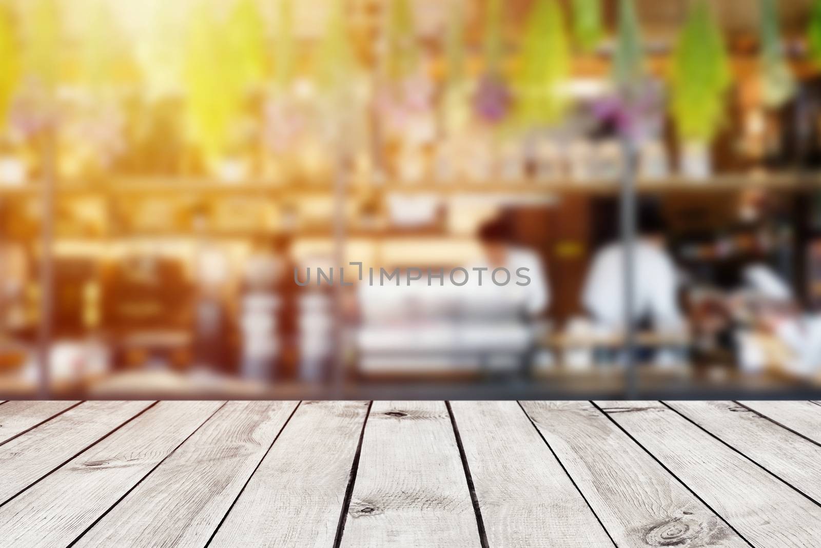 Empty wood table top on blur abstract of cafe or restaurant background, for montage product display