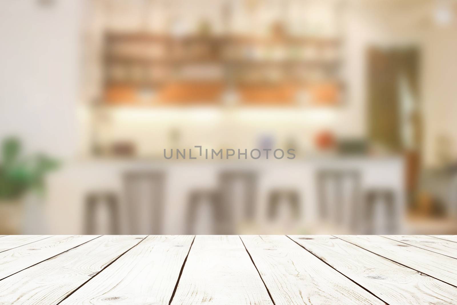 Empty wood table top on blur abstract of cafe or bar background, by nuchylee