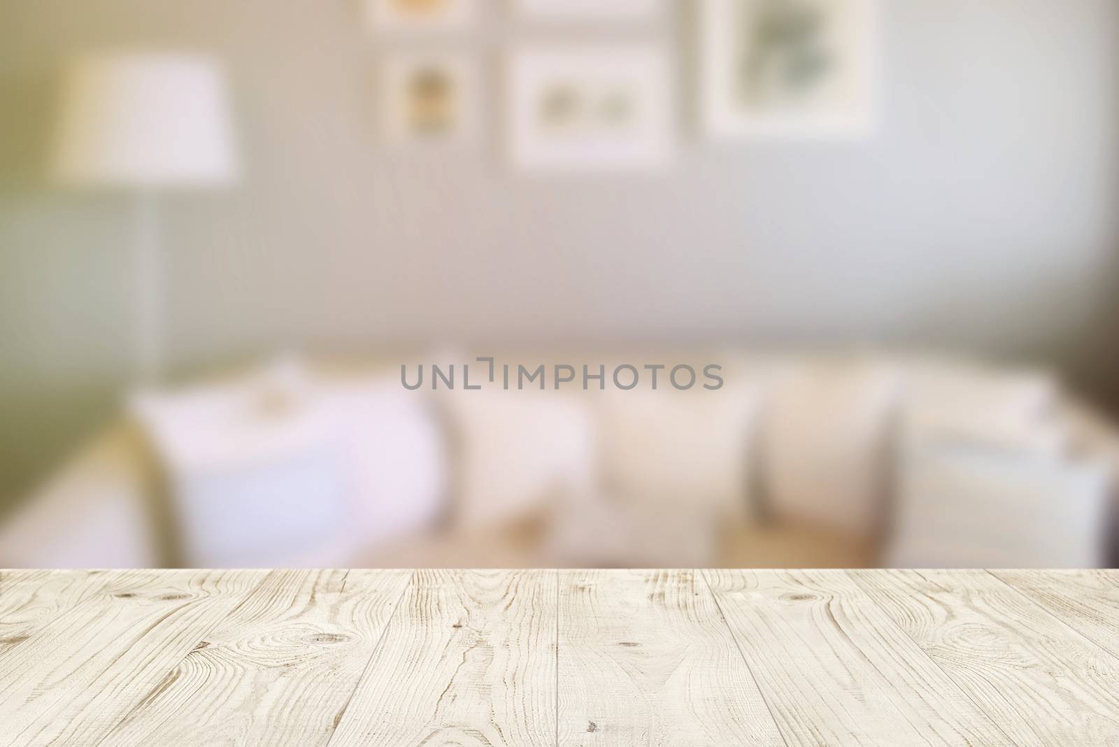 Empty wood table top on blur abstract of interior in living room by nuchylee
