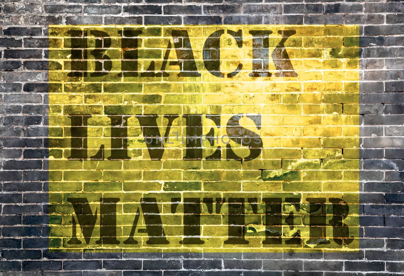 Black Lives Matter slogan protestors anti Black racism african American yellow stencil pattern background floor black brick of dark stone dirty texture