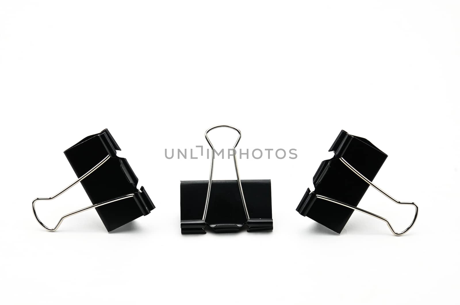 Binder clips paper clamp on an isolated background by moviephoto