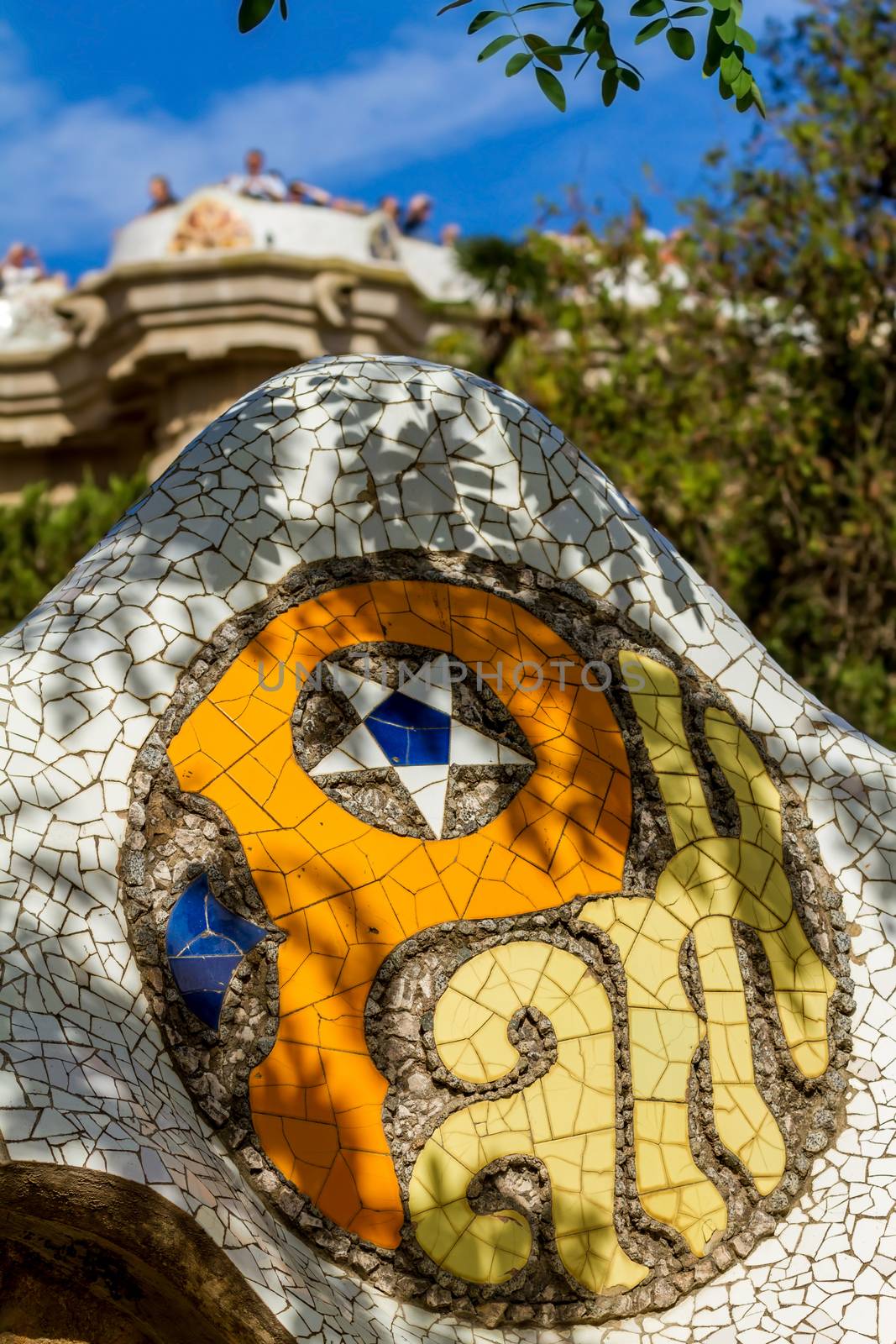 Detail of colorful mosaic work of Park Guell. Barcelona of Spain by Digoarpi