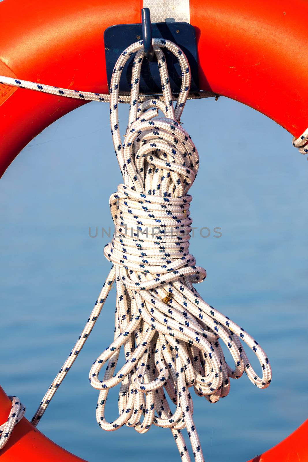 Orange life buoy with rope