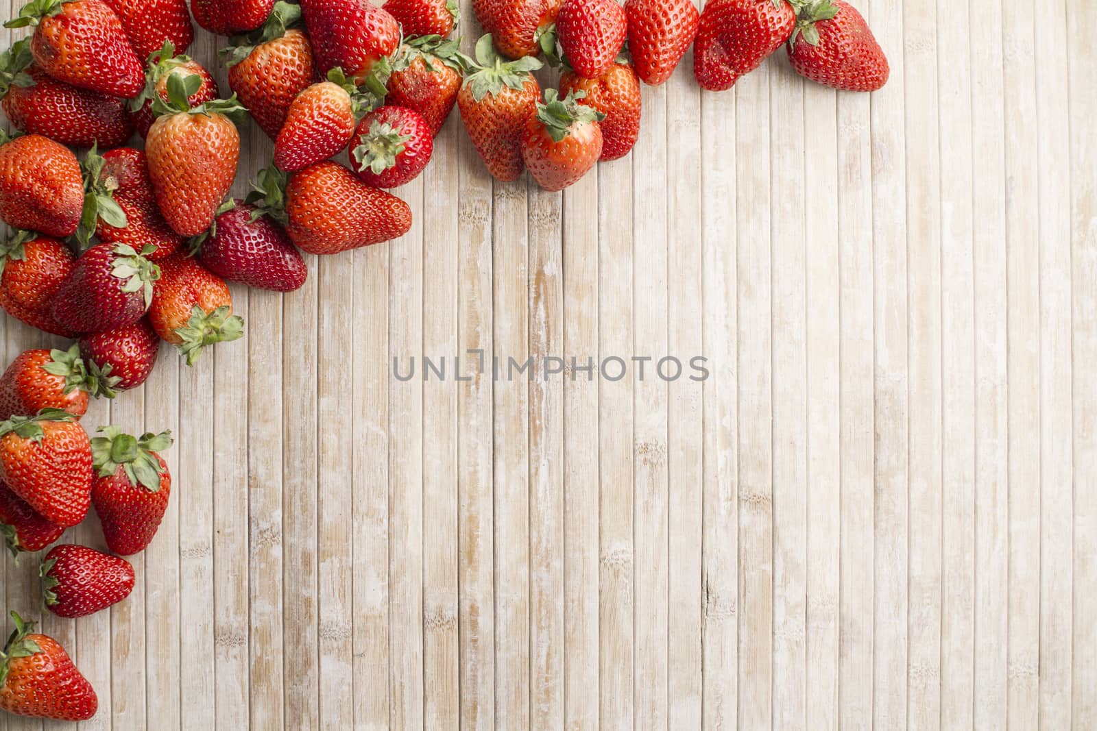 Strawberries copy space with strawberries in the upper left corn by robbyfontanesi