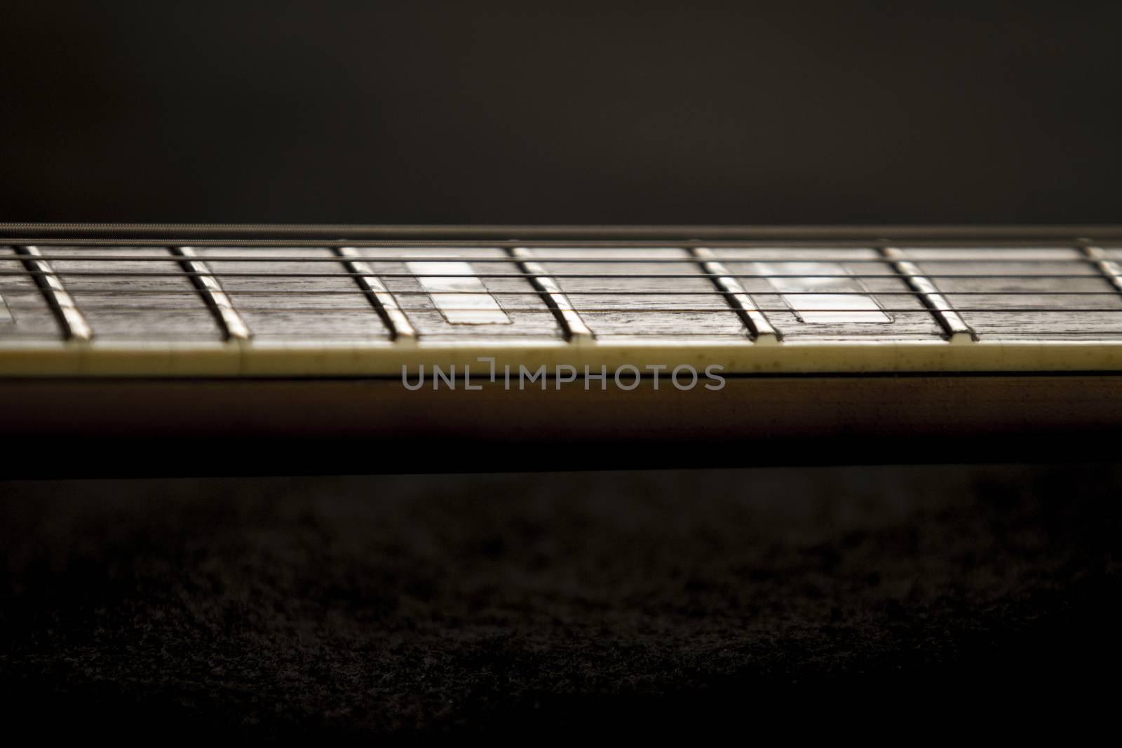 Vintage archtop guitar in natural maple close-up high angle view by robbyfontanesi