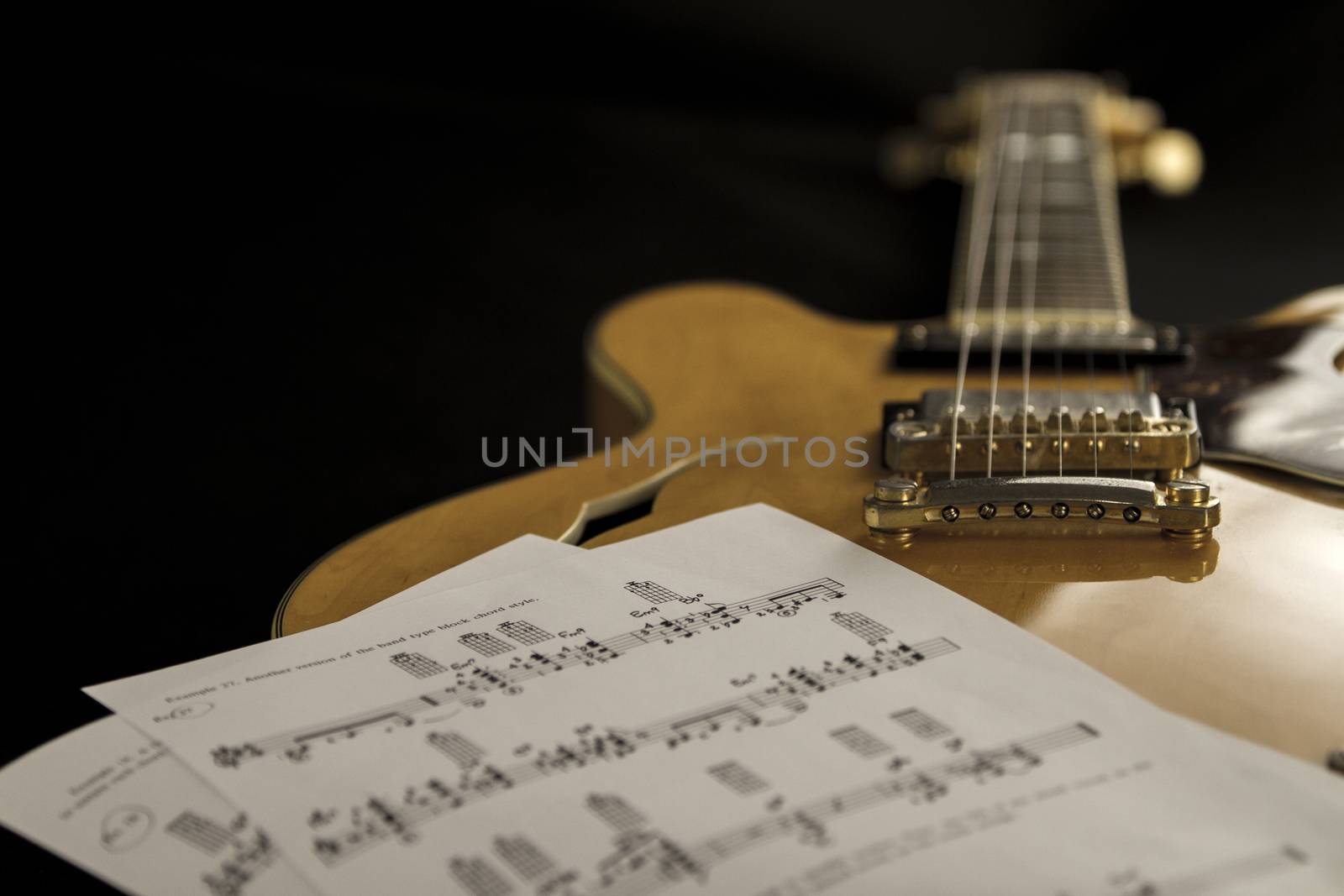 Vintage archtop guitar in natural maple close-up high angle view by robbyfontanesi