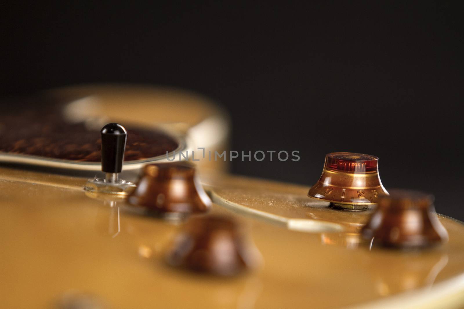 Vintage archtop guitar in natural maple close-up high angle view by robbyfontanesi