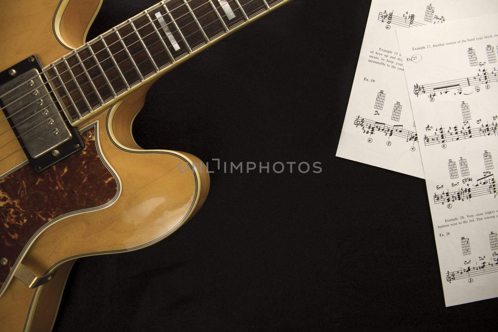 Vintage archtop guitar in natural maple close-up from above with by robbyfontanesi