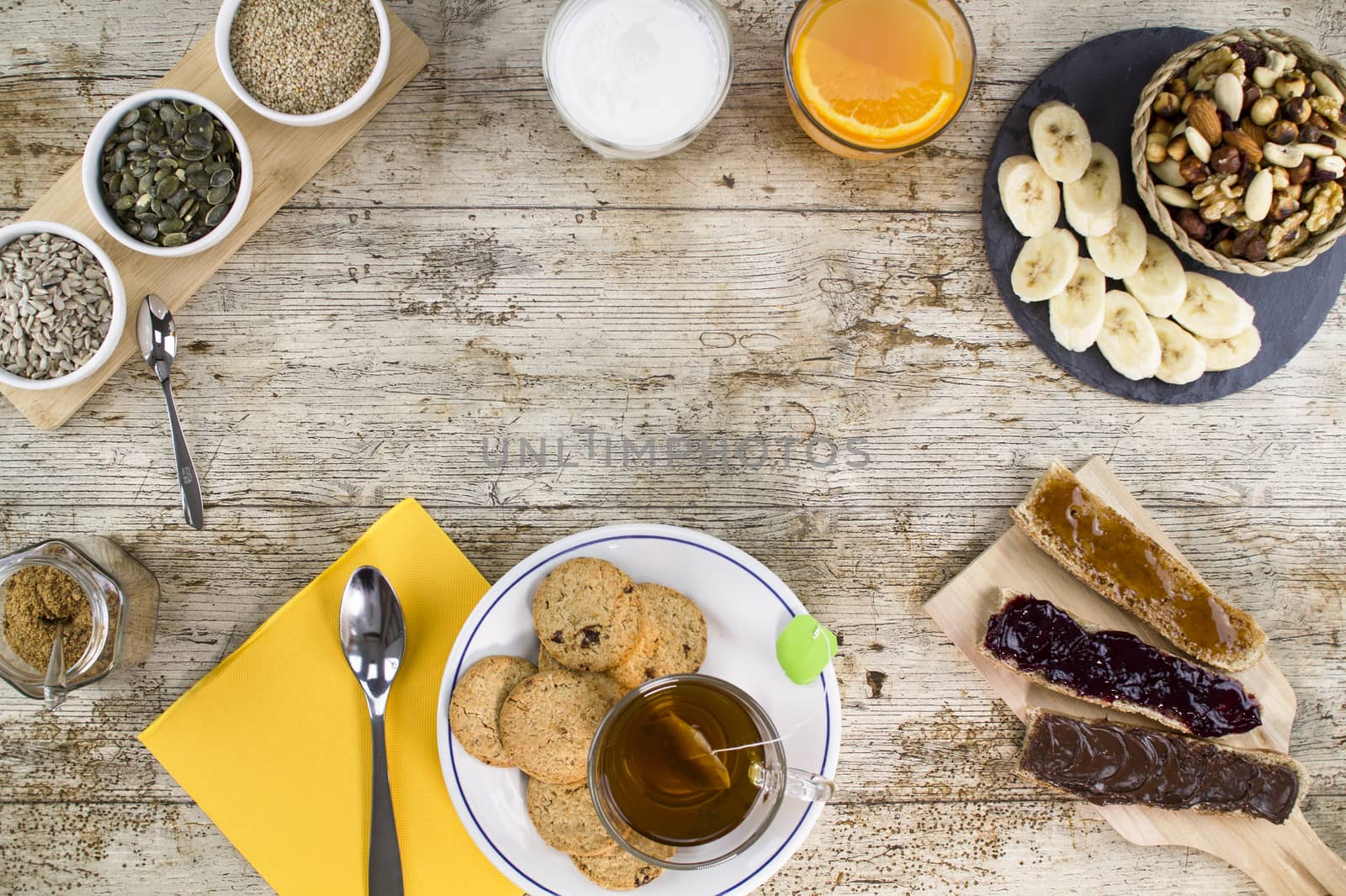 Wooden table set for a sweet vegan breakfast shot from above wit by robbyfontanesi