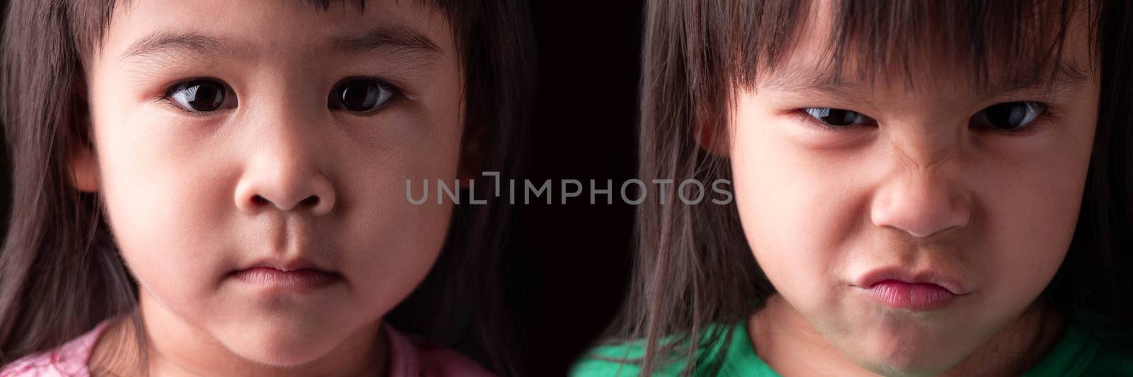 Portrait half face of Asian sibling child girls with sad and angry expression on dark background.